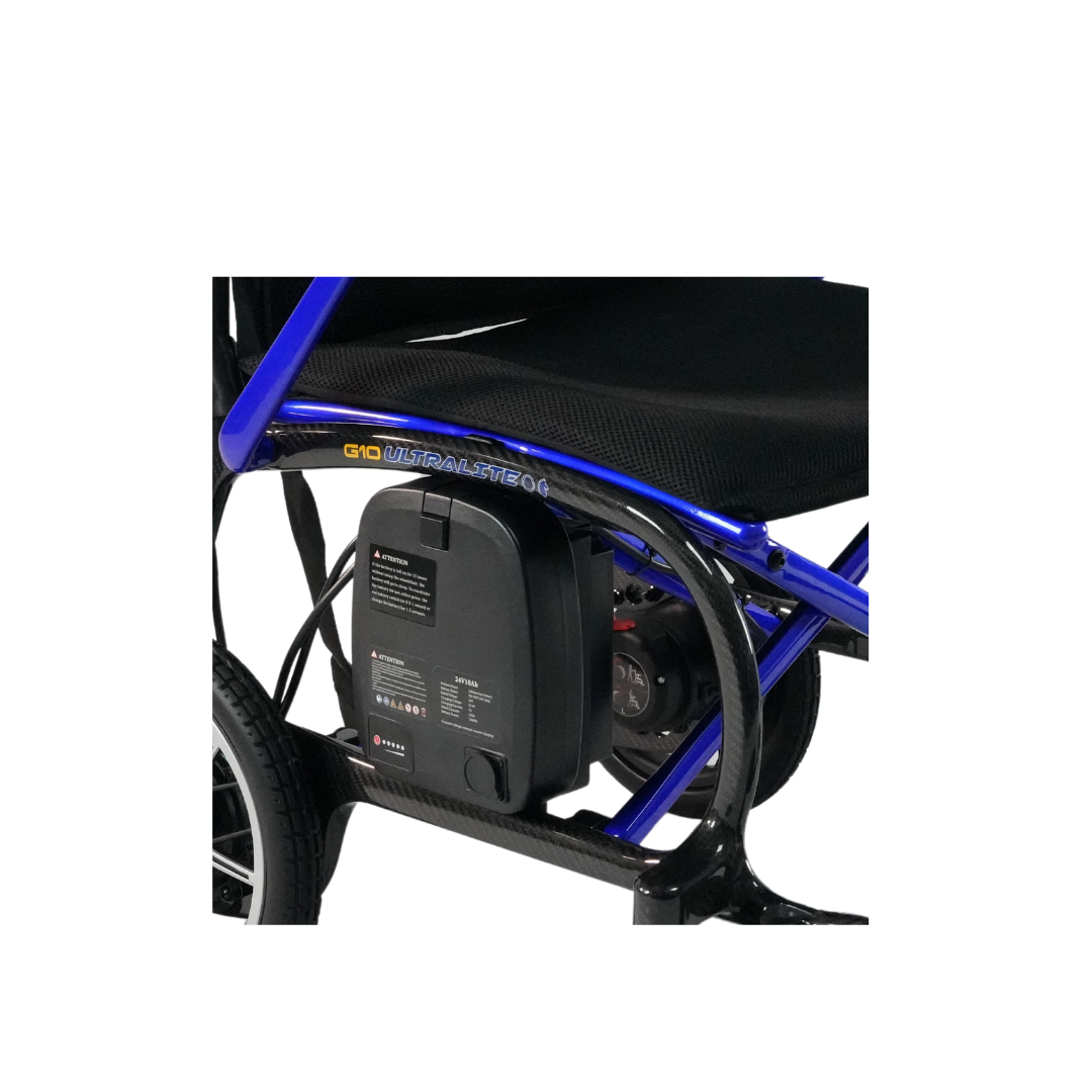 Close-up of a blue and black electric wheelchair frame, showcasing the Forcemech Replacement Battery For G10 Carbon Powerchair beneath the seat and part of the rear wheel.